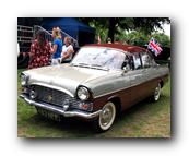 A picture containing text, car, outdoor, transport

Description automatically generated